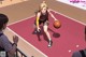 A woman dribbling a basketball on a basketball court.